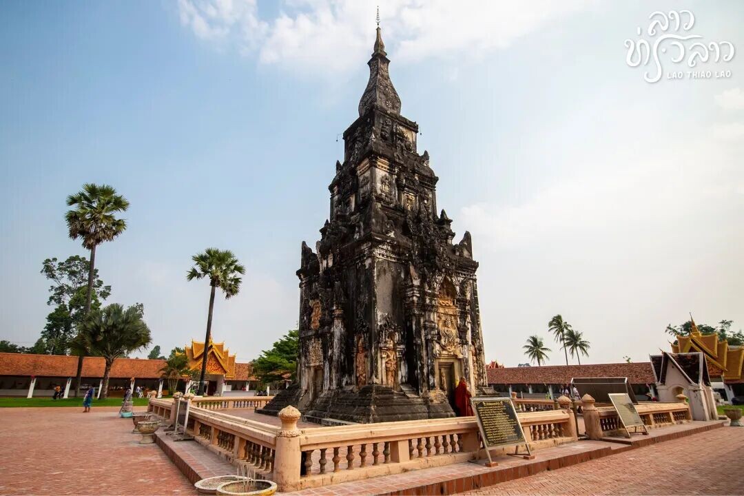 May be an image of 4 people, temple, monument and text