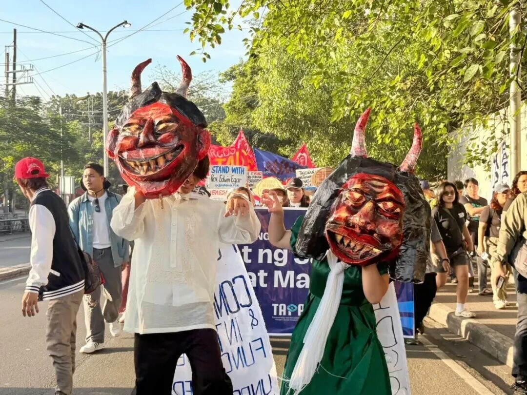 Members of Bagong Alyansang Makabayan march toward Liwasang Bonifacio in Manila as part of protest actions marking the 40th anniversary of the EDSA People Power Revolution on Feb. 25, 2026.