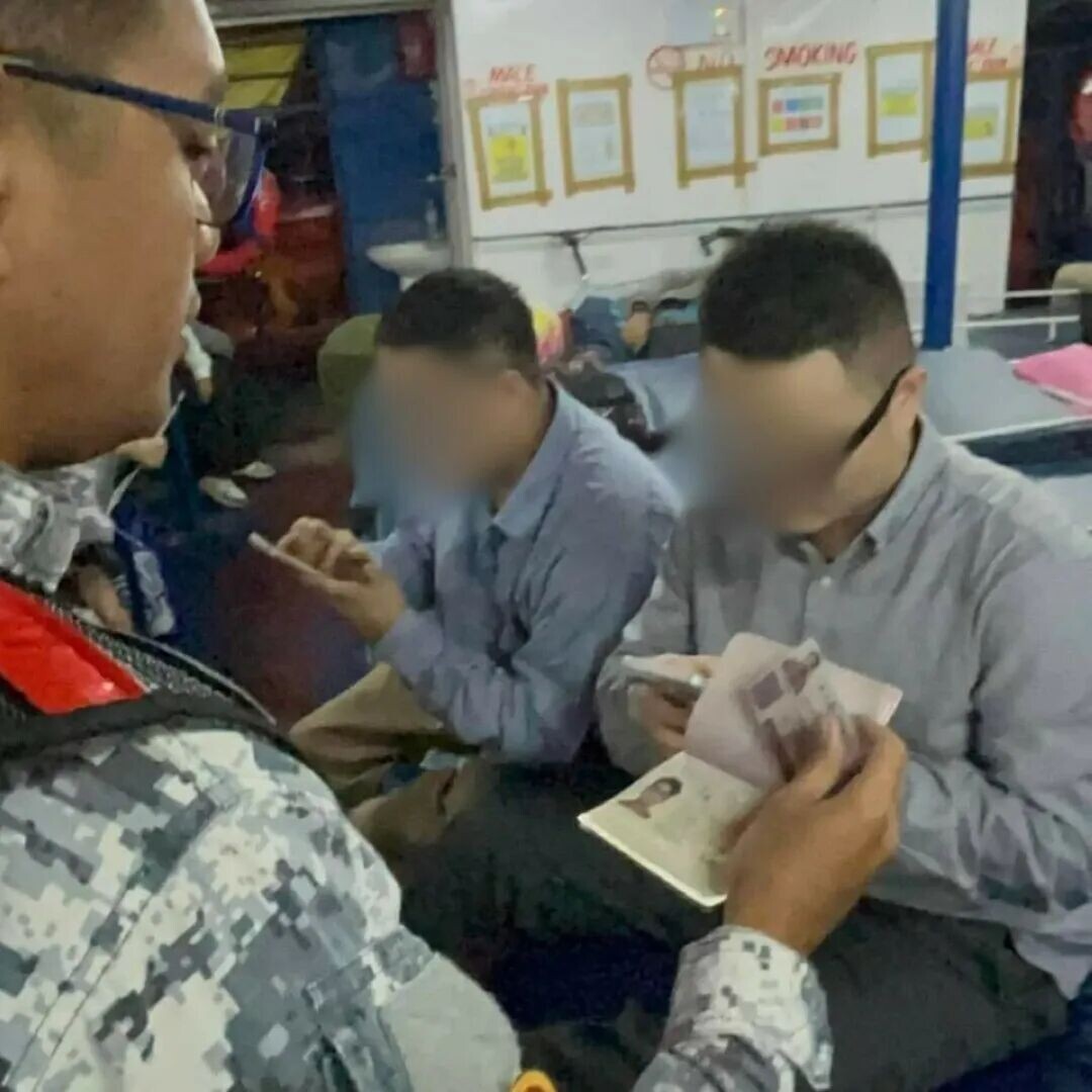 Two Chinese nationals were apprehended by personnel of the Coast Guard Station Zamboanga on March 23, 2026 after they allegedly used falsified travel documents to enter Jolo, Sulu. (Photo: Philippine Coast Guard)