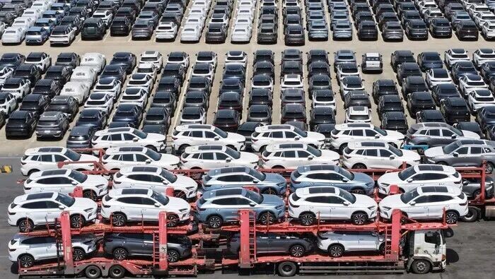 SHANGHAI, CHINA - APRIL 17: Aerial view of trucks loaded with new energy vehicles for export at a terminal of Shanghai port on April 17, 2025 in Shanghai, China. (Photo by Long Wei/VCG via Getty Images)